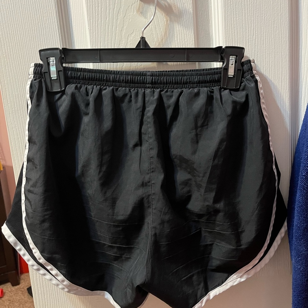Nike running shorts. Black with white strips size Small